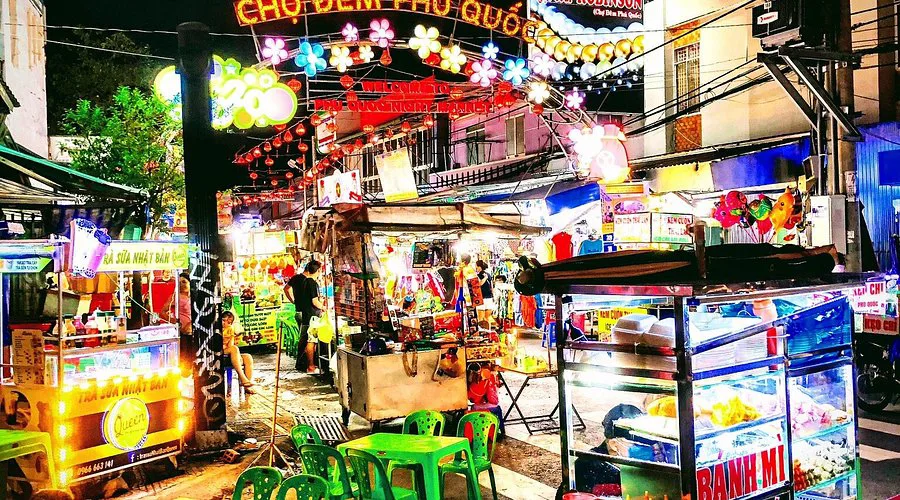 A bustling market stall in Phu Quoc displaying various local products and fresh produce