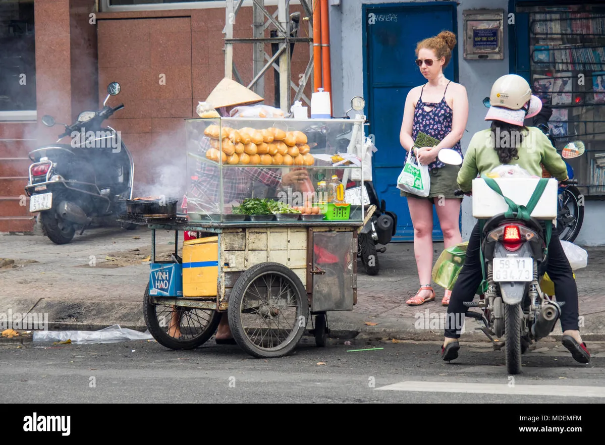 Fresh banh mi being prepared at a street food stall
