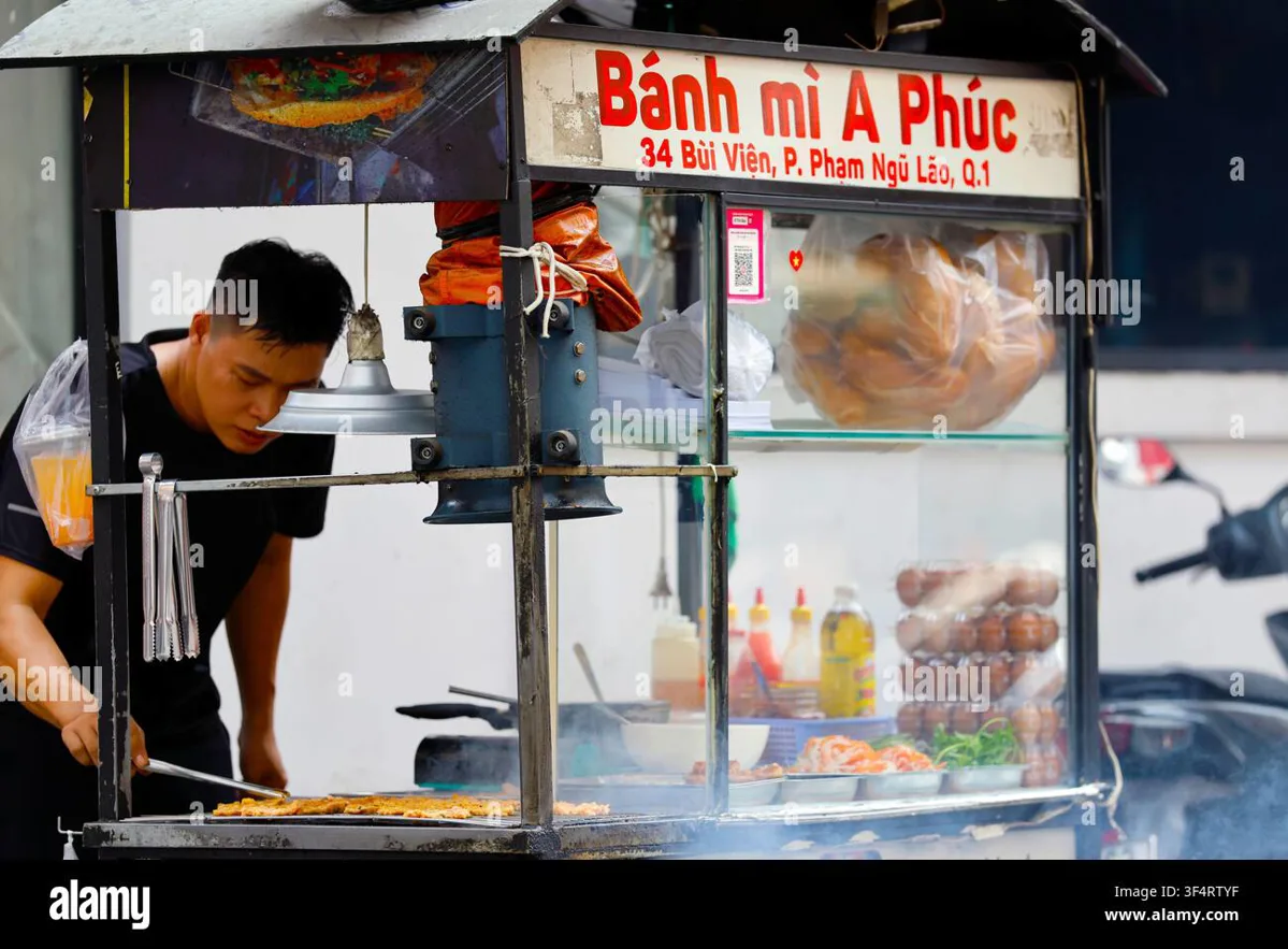 Fresh banh mi being prepared at a street food stall