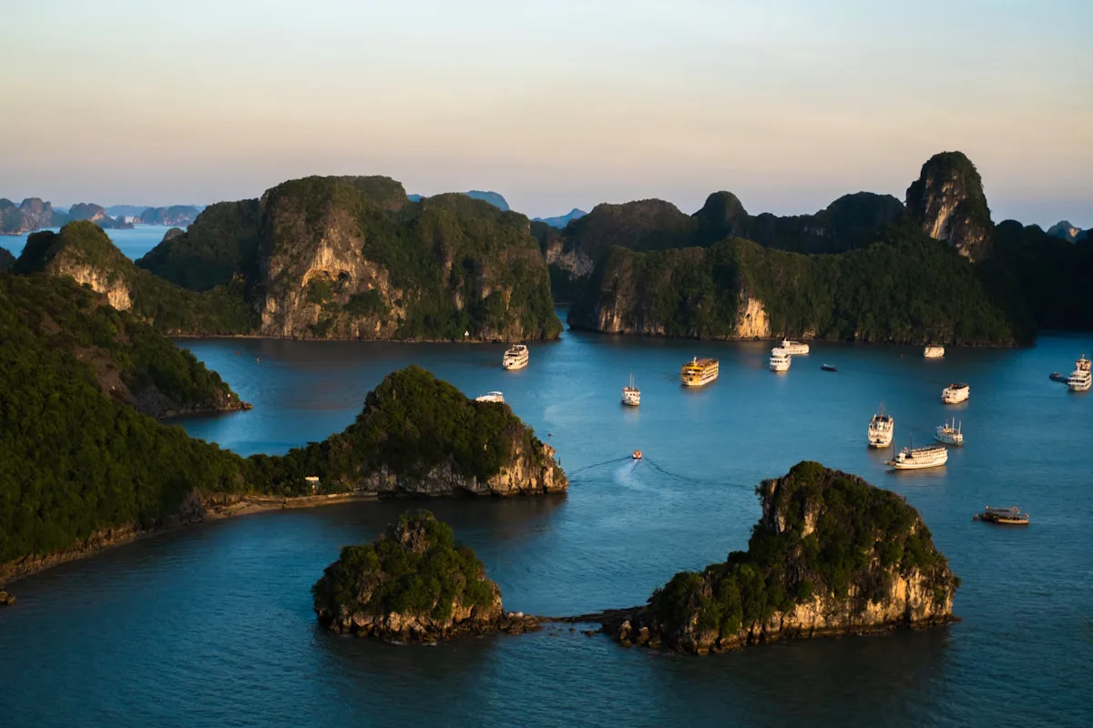 Karst islands rising from emerald water in Ha Long Bay
