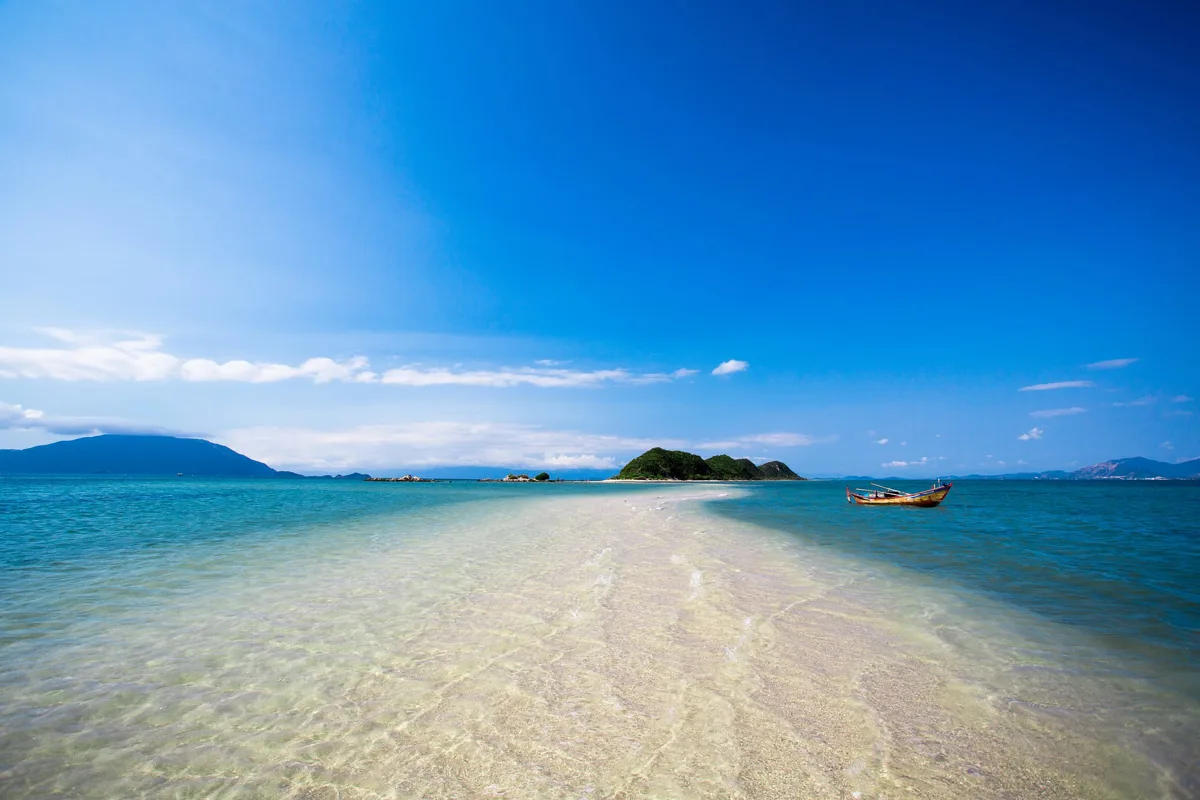 Panoramic view of Nha Trang Beach with white sand, blue sea and coastal skyline