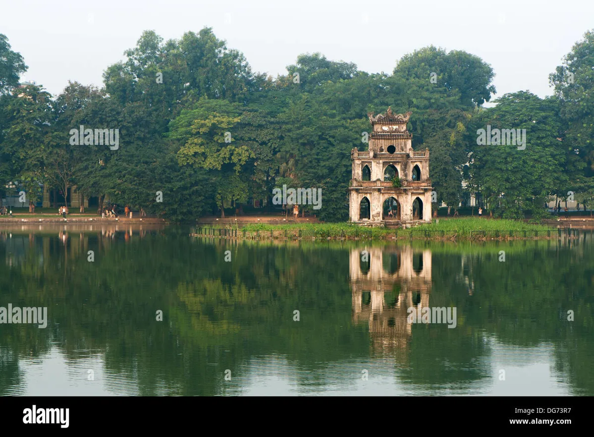Hoan Kiem Lake with Turtle Tower and tree-lined paths at sunrise