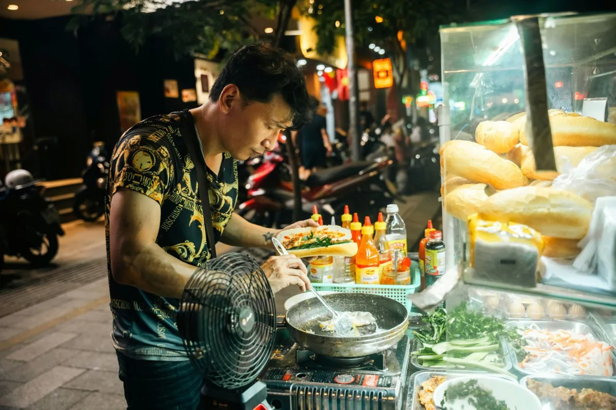 Fresh banh mi being prepared at a street food stall