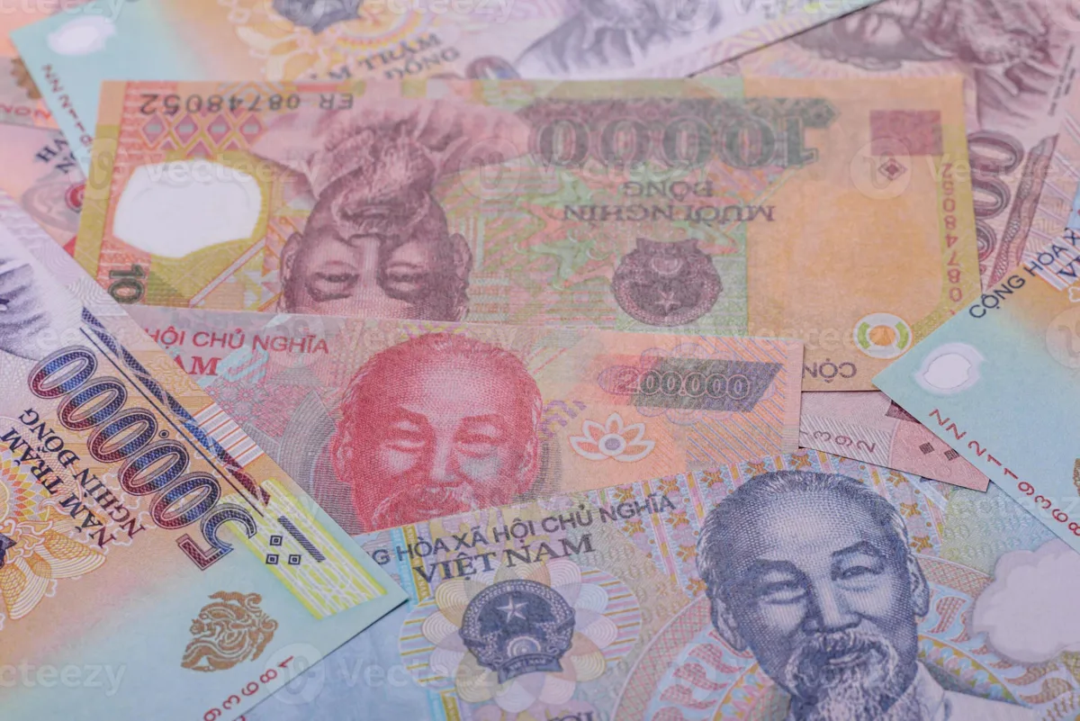 Spread of Vietnamese Dong banknotes on a table