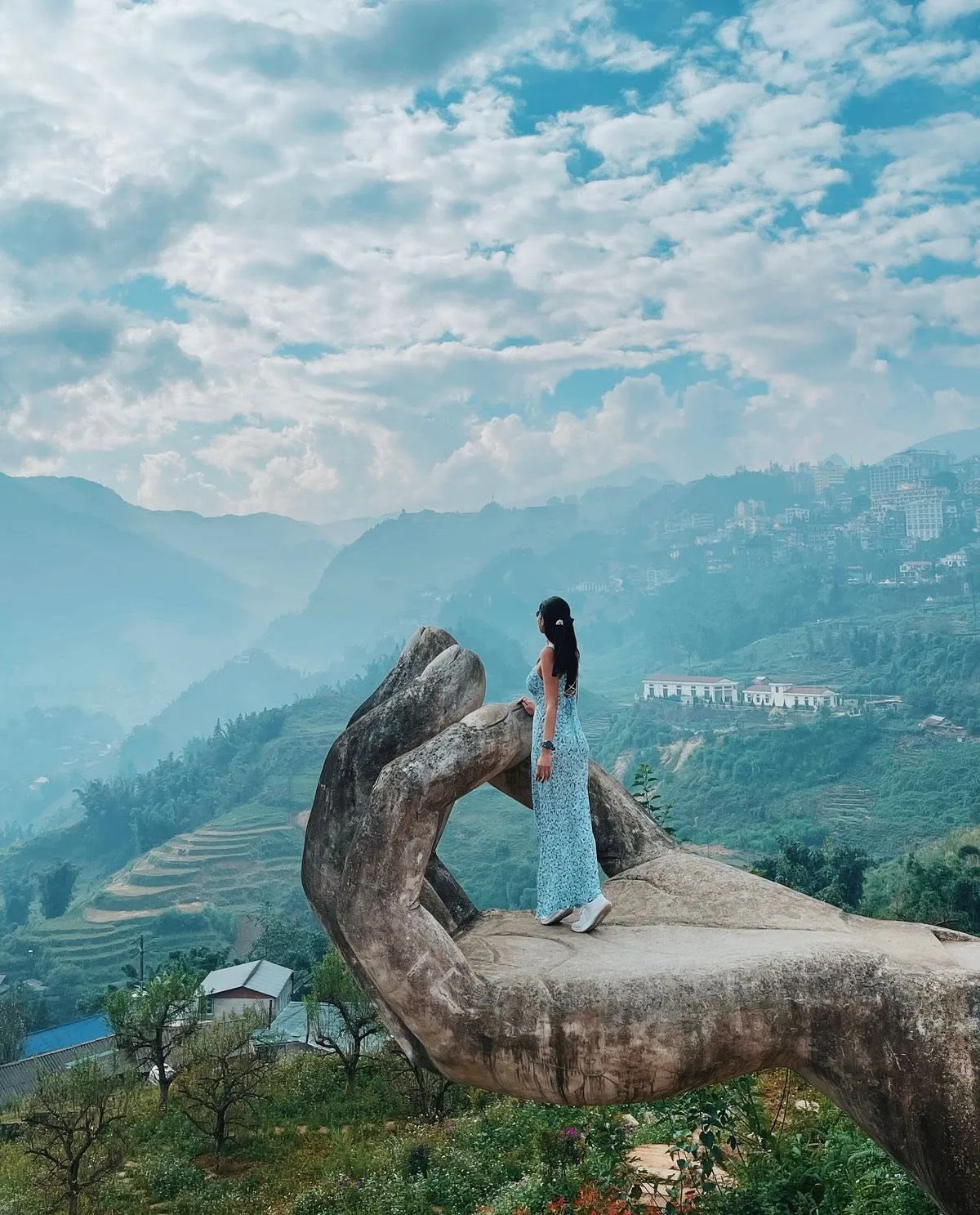 Panoramic view of Sapa's iconic terraced rice fields in Muong Hoa Valley, with ethnic minority villages nestled among the mou