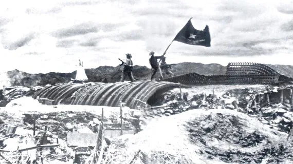 Panoramic view of Dien Bien Phu city and the surrounding lush green valleys and mountains, with historical sites visible