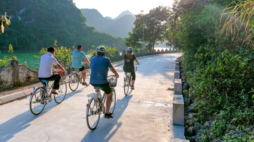 Cycling along winding village on Cat Ba Island